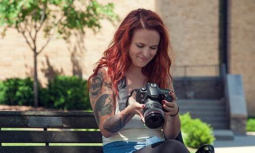 student with a camera